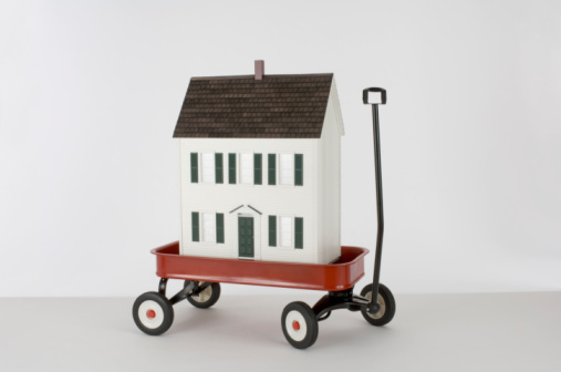 Miniature house in toy wagon